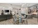 Open living space with fireplace flows from gourmet kitchen and stainless appliances at 10482 Calico Terrace Ave, Las Vegas, NV 89135