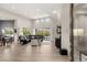 Bright, open-concept living room with high ceilings, large windows, and wood floors, creating an airy atmosphere at 10482 Calico Terrace Ave, Las Vegas, NV 89135
