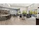 Spacious living area featuring an open layout, sleek kitchen island, and a modern design aesthetic at 10482 Calico Terrace Ave, Las Vegas, NV 89135