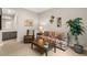 Inviting living room showcasing stylish floral sofa, leather chair, and tasteful décor at 10482 Calico Terrace Ave, Las Vegas, NV 89135