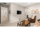 Bright living room featuring a mounted TV, comfortable seating, and contemporary design at 10482 Calico Terrace Ave, Las Vegas, NV 89135