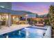 Relaxing backyard with a pool, patio, outdoor kitchen, and inviting seating area at 10482 Calico Terrace Ave, Las Vegas, NV 89135
