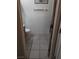 Compact bathroom with a toilet, towel rack, and tiled flooring at 10525 Autumn Pine Ave # 203, Las Vegas, NV 89144