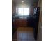 Kitchen with dark countertops, wood cabinets, and stainless steel appliances at 10525 Autumn Pine Ave # 203, Las Vegas, NV 89144