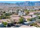 Suburban landscape featuring a harmonious blend of homes, lush greenery, and mountain views at 11763 Kingsland Ave, Las Vegas, NV 89138