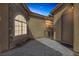 Charming courtyard featuring a stone arch window and a private entrance at 11763 Kingsland Ave, Las Vegas, NV 89138