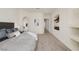Spacious main bedroom features an arched doorway to the bathroom, neutral paint, and plush carpeting at 11763 Kingsland Ave, Las Vegas, NV 89138