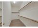 Spacious walk-in closet with carpet, shelving, and a built-in mirror at 11763 Kingsland Ave, Las Vegas, NV 89138