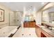 Luxurious bathroom with soaking tub, glass shower, and dual sink vanity at 125 E Harmon Ave # 1620, Las Vegas, NV 89109