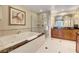 Elegant bathroom featuring a soaking tub, glass-enclosed shower, and vanity at 125 E Harmon Ave # 1620, Las Vegas, NV 89109