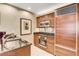 Modern kitchenette featuring granite countertops, stainless steel appliances, and custom cabinetry at 125 E Harmon Ave # 1620, Las Vegas, NV 89109