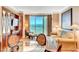Comfortable living area offering a scenic view, dining space, and a lounge chair to sit and enjoy the view at 125 E Harmon Ave # 1620, Las Vegas, NV 89109