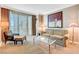 Modern living space featuring a comfortable seating area, coffee table, and scenic views from the balcony at 125 E Harmon Ave # 1620, Las Vegas, NV 89109