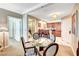 Comfortable living space showcasing a dining area, kitchen access and a partial view into a bathroom at 125 E Harmon Ave # 1620, Las Vegas, NV 89109