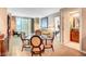Open living area featuring a round dining table with chairs and a doorway leading to a bathroom at 125 E Harmon Ave # 1620, Las Vegas, NV 89109