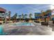 Gorgeous community pool surrounded by swaying palm trees and shaded lounging areas at 125 E Harmon Ave # 1620, Las Vegas, NV 89109