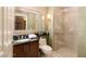 Bathroom featuring a vanity, toilet, and a glass enclosed shower at 125 E Harmon Ave # 2514, Las Vegas, NV 89109
