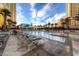 Upscale pool area surrounded by palm trees and comfortable lounge chairs at 125 E Harmon Ave # 2514, Las Vegas, NV 89109