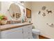 Bathroom featuring a white vanity, decorative mirror, and Southwestern-inspired wall decor at 1253 Country Club Dr, Laughlin, NV 89029