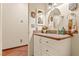 Bathroom featuring a white vanity, decorative mirror, and Southwestern-inspired decor at 1253 Country Club Dr, Laughlin, NV 89029