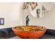 Close-up of a unique bathroom sink with an artistic vessel and sleek black faucet at 1253 Country Club Dr, Laughlin, NV 89029