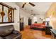 Comfortable bedroom with stained glass windows and adjoining bathroom at 1253 Country Club Dr, Laughlin, NV 89029
