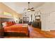 Bedroom with stained glass windows, ceiling fan, tile floors and sitting area at 1253 Country Club Dr, Laughlin, NV 89029