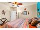 Inviting bedroom with southwestern inspired decor, including a unique chair and colorful artwork at 1253 Country Club Dr, Laughlin, NV 89029