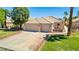 Charming single-story home with desert landscaping, mature trees, and large driveway at 1253 Country Club Dr, Laughlin, NV 89029