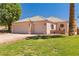 Charming single-story home with a tile roof, a two-car garage, and a well-manicured lawn at 1253 Country Club Dr, Laughlin, NV 89029