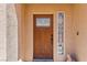 Elegant front door with stained glass window, and doorbell at 1253 Country Club Dr, Laughlin, NV 89029