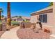 Landscaped front yard with a desert motif, artificial ram statue, and desert-friendly vegetation at 1253 Country Club Dr, Laughlin, NV 89029