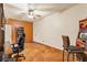 Spacious game room with a ceiling fan, tile flooring, and a vintage arcade game at 1253 Country Club Dr, Laughlin, NV 89029