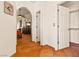 Hallway with arched entryway, tile floor, closet and glimpses of the adjacent bedroom at 1253 Country Club Dr, Laughlin, NV 89029