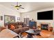 Spacious living room with comfortable seating, fireplace, and tile flooring. Ceiling fan included at 1253 Country Club Dr, Laughlin, NV 89029