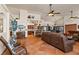 Open-concept living room and kitchen area with tile flooring and comfortable seating at 1253 Country Club Dr, Laughlin, NV 89029