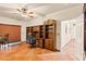 Home office with large bookcase, desk and neutral walls at 1253 Country Club Dr, Laughlin, NV 89029