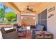 Comfortable outdoor patio with desert landscape and ceiling fan at 1253 Country Club Dr, Laughlin, NV 89029