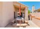 Charming covered patio with tiled table, benches, BBQ and outdoor kitchen at 1253 Country Club Dr, Laughlin, NV 89029