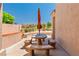 Charming covered patio with tiled table, benches, overlooking the golf course at 1253 Country Club Dr, Laughlin, NV 89029