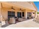 Covered patio with lounge seating and ceiling fans at 1253 Country Club Dr, Laughlin, NV 89029