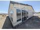 Newly constructed home showcasing large picture windows and a stylish exterior, ready for finishing touches at 1280 S Yosemite Ave, Pahrump, NV 89048
