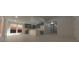 An open-concept living and dining area with modern finishes and ample natural light, perfect for entertaining at 1280 S Yosemite Ave, Pahrump, NV 89048