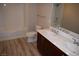 Bathroom featuring dual sinks, modern cabinets, and a combination tub and shower at 150 N Las Vegas Blvd # 1217, Las Vegas, NV 89101