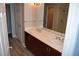Bright bathroom with double sinks, modern fixtures, adjoins shower and door; vanity has custom cabinet at 150 N Las Vegas Blvd # 1217, Las Vegas, NV 89101
