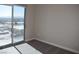Bright bedroom featuring a large window with city views and neutral carpeting at 150 N Las Vegas Blvd # 1217, Las Vegas, NV 89101