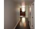 Hallway view, highlighting hardwood floors and access to the modern kitchen at 150 N Las Vegas Blvd # 1217, Las Vegas, NV 89101