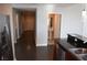 Hallway view of the entry door and access to the bathroom, hardwood flooring and stainless steel appliances at 150 N Las Vegas Blvd # 1217, Las Vegas, NV 89101