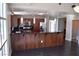 Kitchen and dining area with stainless appliances, cherry cabinets, pendant lighting, and breakfast bar at 150 N Las Vegas Blvd # 1217, Las Vegas, NV 89101