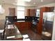 Contemporary kitchen featuring dark granite countertops, stainless steel appliances, and modern pendant lighting at 150 N Las Vegas Blvd # 1217, Las Vegas, NV 89101